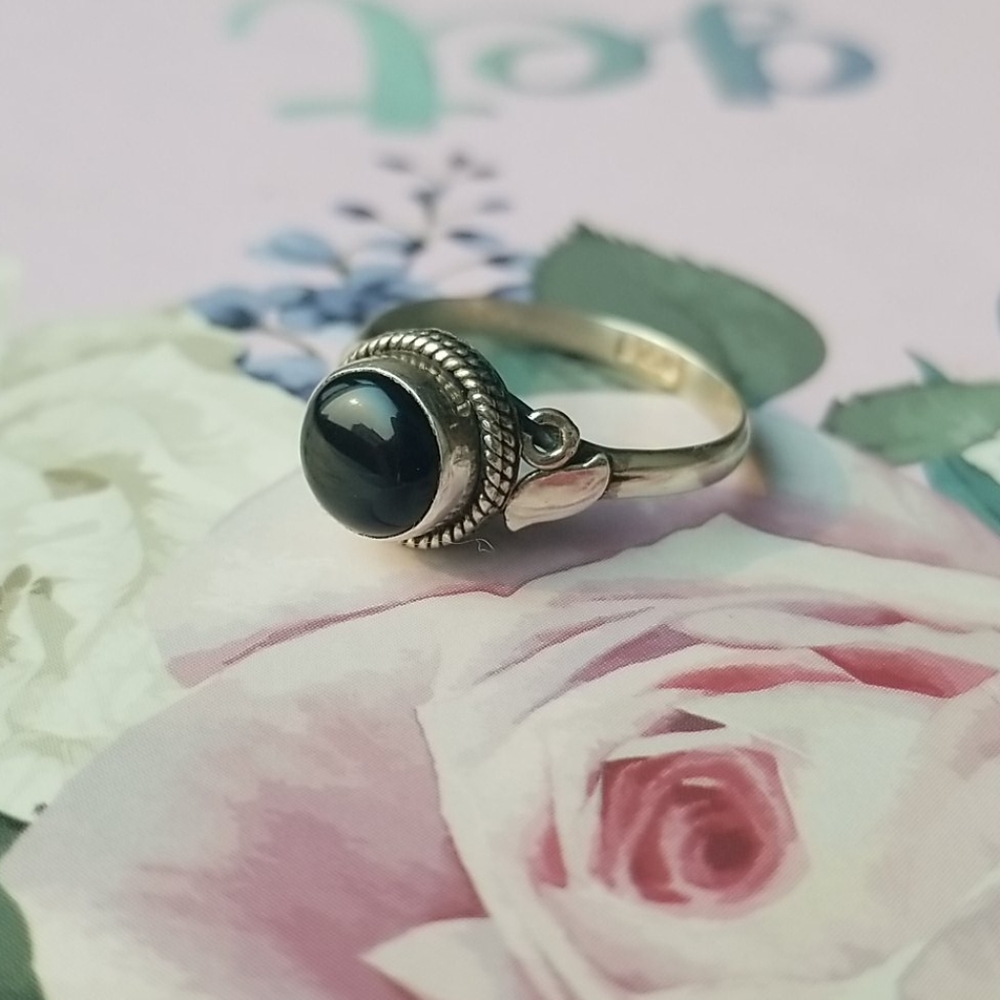 Silver and black onyx ring.